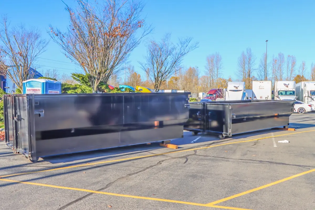 Professional dumpster rental service with roll-off container on residential driveway in Sun City West